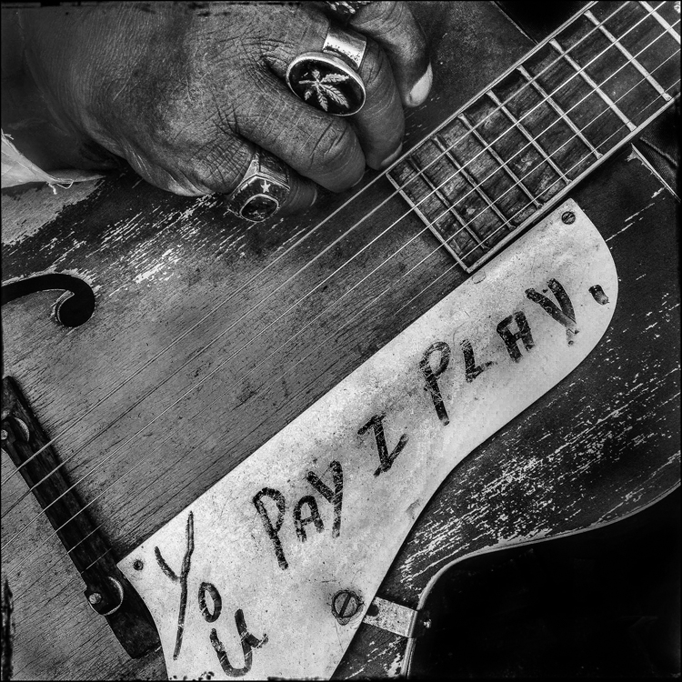 Guitar with You Pay I Play written on it